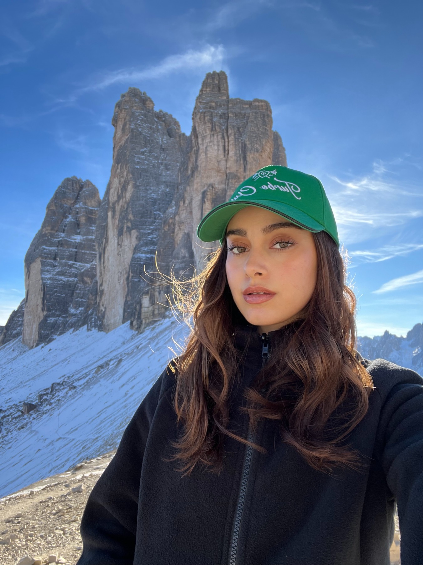Esma in front of the snowy Dolomites